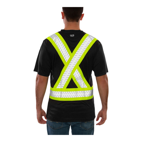 A man wearing a Tingley black short sleeve safety shirt with yellow X-back reflective tape.