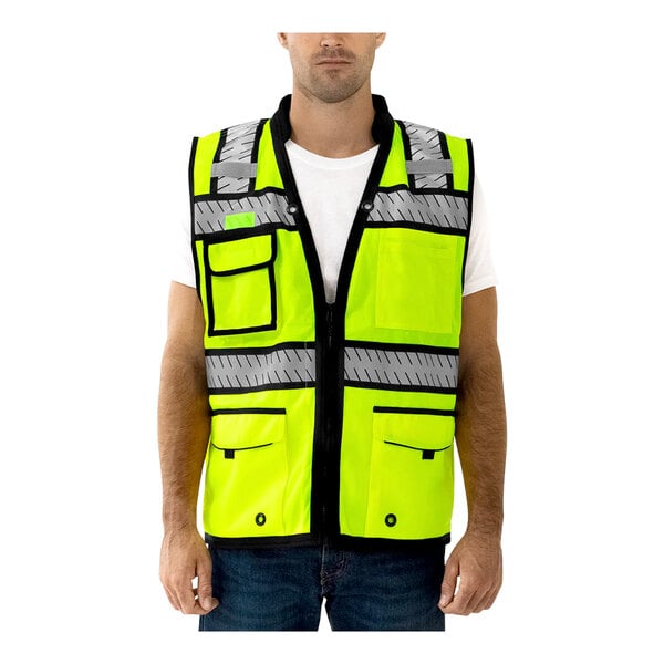 A man wearing a Tingley hi-vis yellow safety vest with X-back reflective tape.