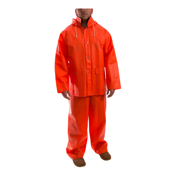 A man wearing an orange Tingley rainsuit.