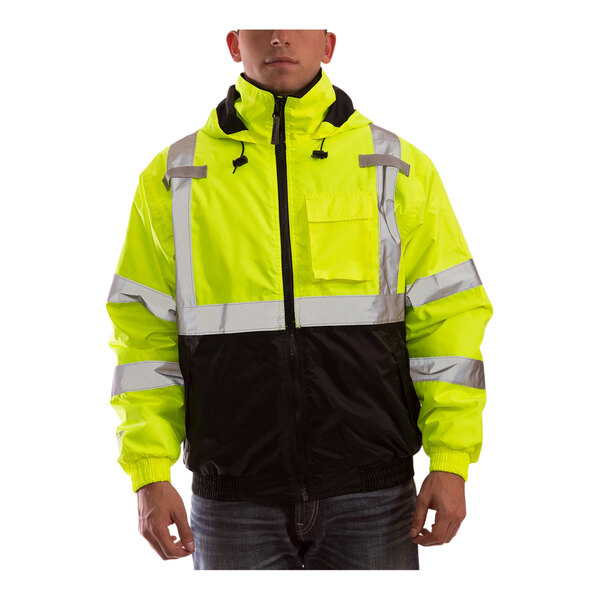 A man wearing a yellow Tingley Bomber II safety jacket with black panels.