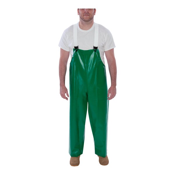A man wearing Tingley green overalls.
