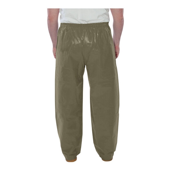 A man wearing Tingley olive green pants.