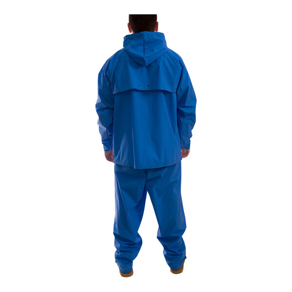 A man wearing a Tingley blue rainsuit.
