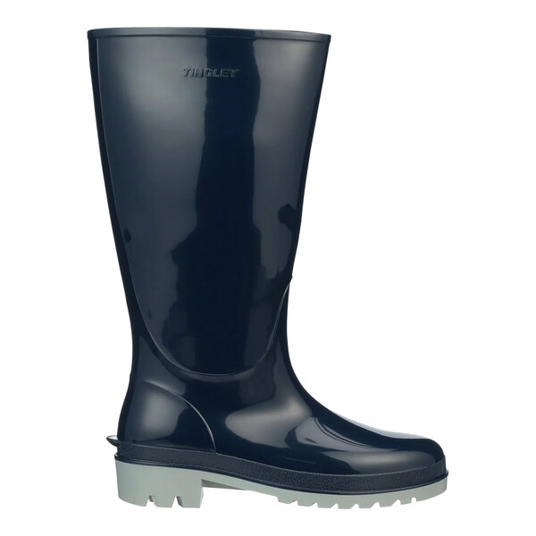 A close up of a Tingley navy blue waterproof knee boot with a rubber sole.