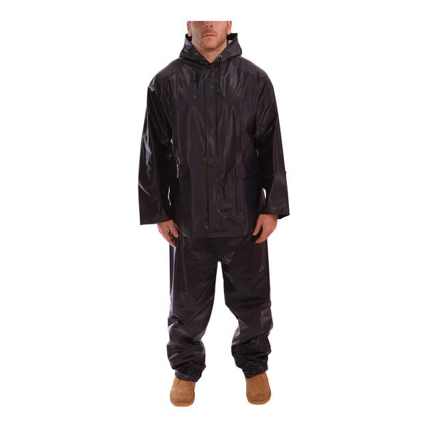 A man wearing a navy Tingley rainsuit.