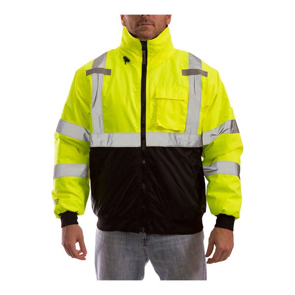 A man wearing a Tingley yellow and black industrial work jacket.