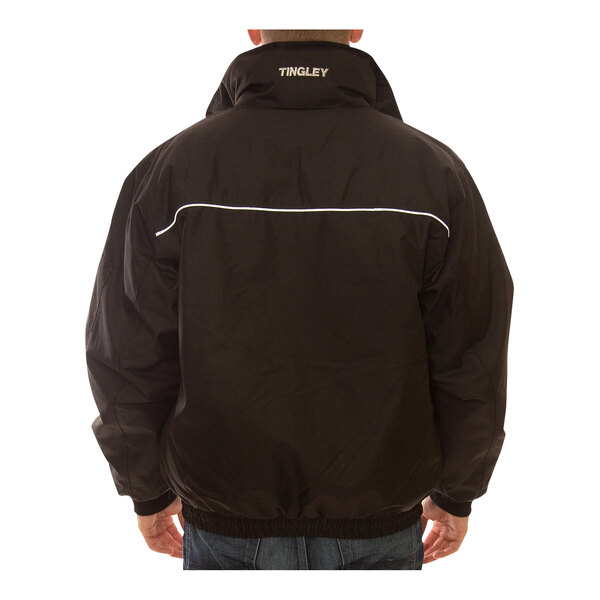 A man wearing a black Tingley insulated jacket.