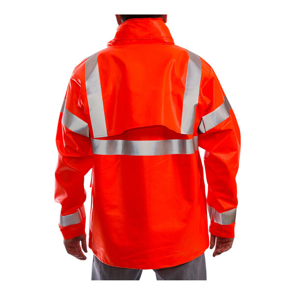 A person wearing a Tingley Hi-Vis orange jacket with reflective stripes.