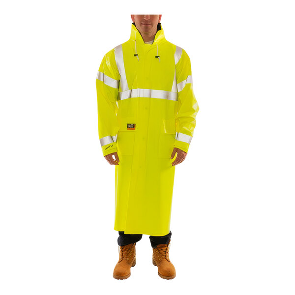 A man wearing a Tingley yellow raincoat with silver reflective tape.