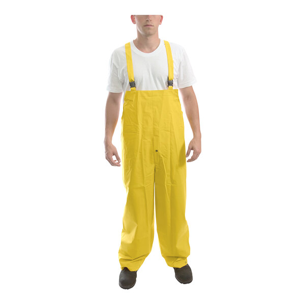 A man wearing a yellow Tingley rainsuit.