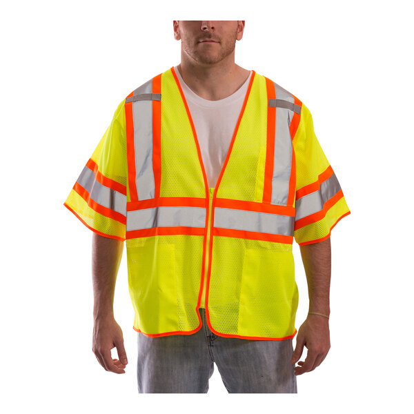 A man wearing a Tingley lime yellow mesh safety vest with sleeves.