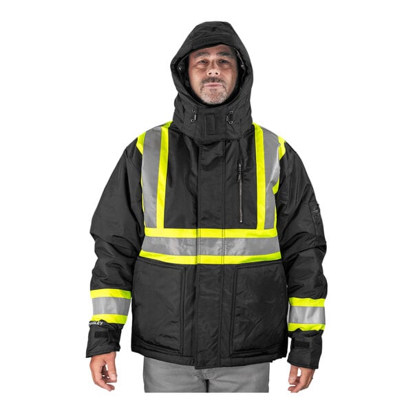 A man wearing a Tingley black and yellow enhanced visibility jacket.