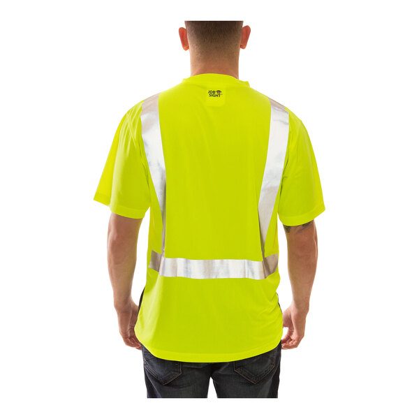 A man wearing a Tingley lime yellow safety shirt with black front panel and reflective stripes.