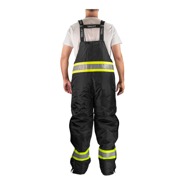 A person wearing Tingley black and yellow reflective overalls.