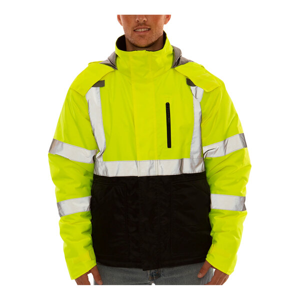 A man wearing a Tingley yellow and black heat-retention jacket.