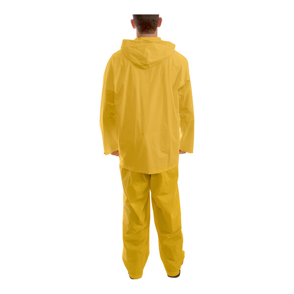 A person wearing a yellow Tingley rainsuit.