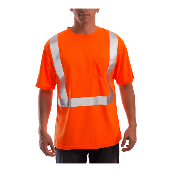 A person wearing a Tingley orange short sleeve safety shirt with reflective stripes.