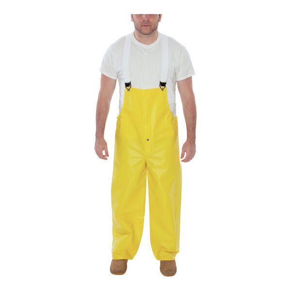 A man wearing yellow Tingley Webdri overalls.