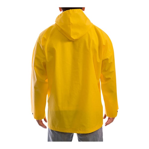 A person wearing a Tingley yellow DuraScrim rain jacket.