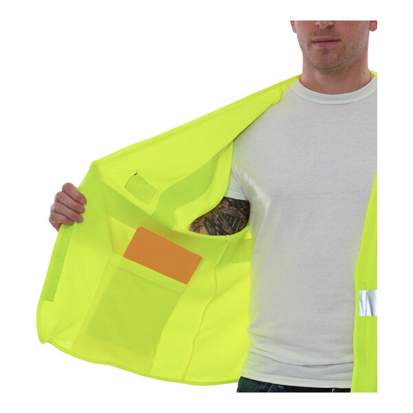 A man wearing a Tingley Hi-Vis lime yellow safety vest.
