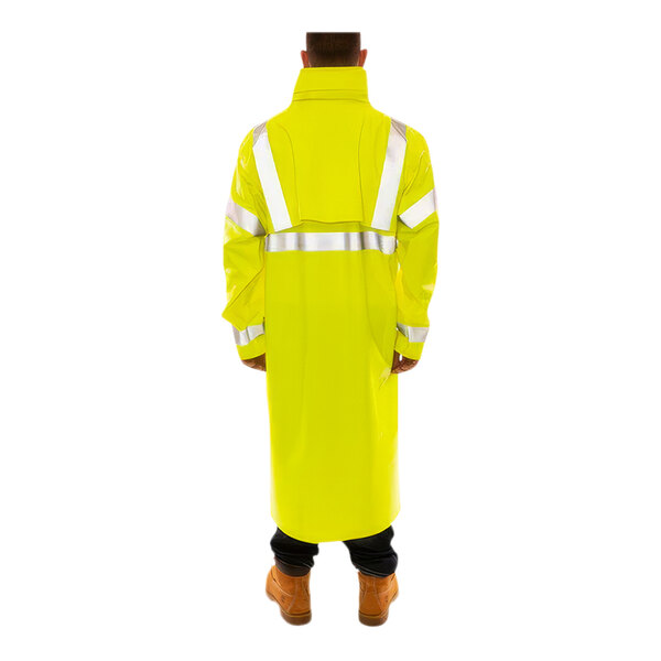 A person wearing a Tingley yellow industrial work coat with reflective tape.