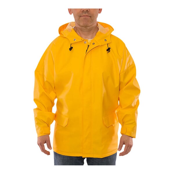 A man wearing a yellow Tingley Weather-Tuff rain jacket.
