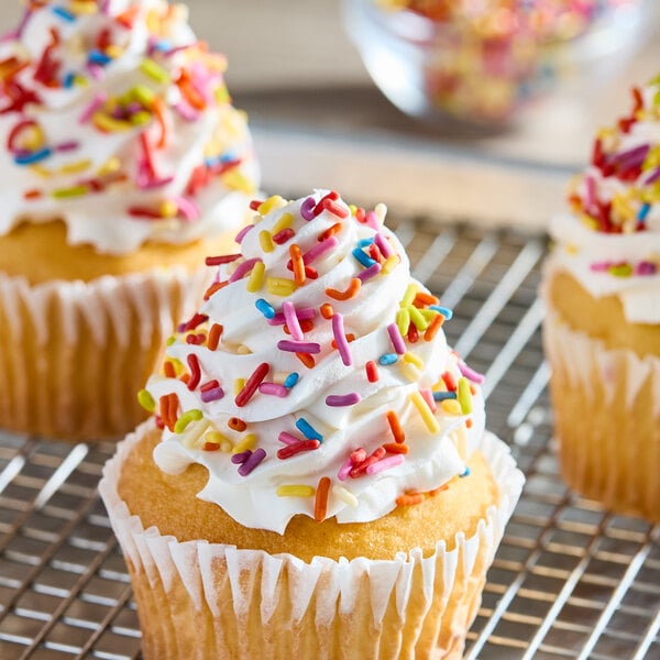 A cupcake with frosting and India Tree Nature's Colors Vegan Fiesta Mix Sprinkles.