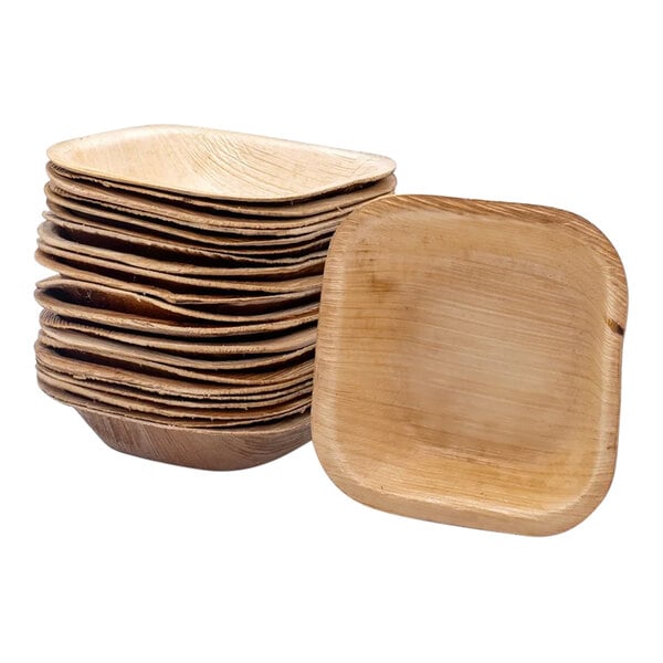A stack of VerTerra square palm leaf plates on a white background.