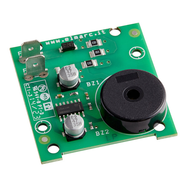 A green circuit board with a black round button.