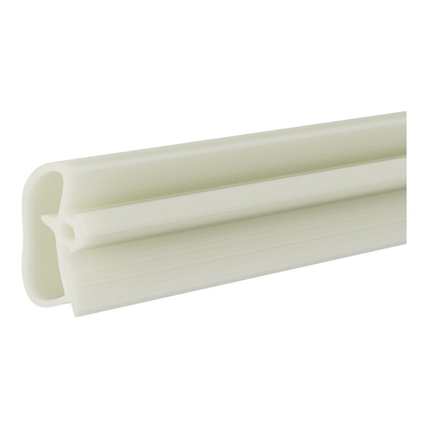 A close-up of a white plastic strip with a long handle.