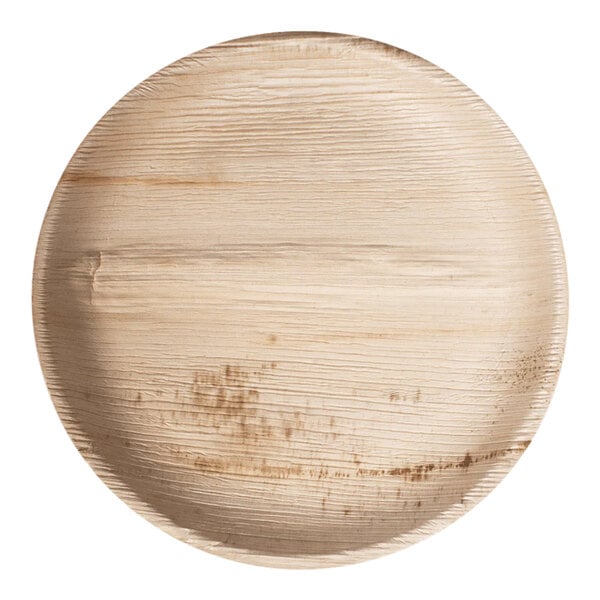 A VerTerra round palm leaf plate with a textured surface.