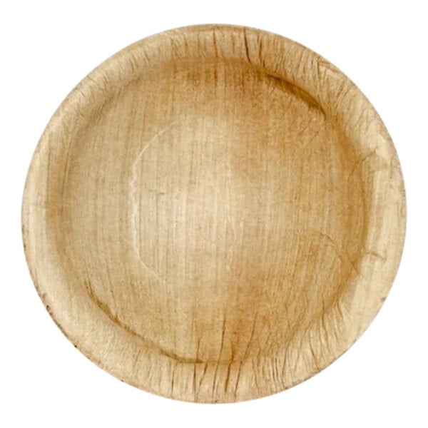 A VerTerra round palm leaf bowl with a circular edge.