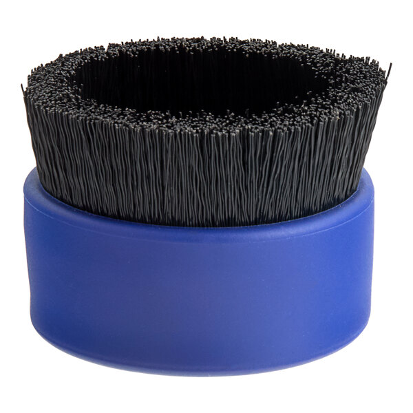 A blue circular Waterloo scrub brush with black bristles.