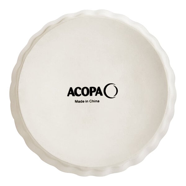 An ivory Acopa fluted porcelain dish with a logo.