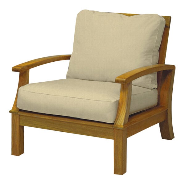 A Three Birds Casual Monterey sand wooden arm chair with beige cushions.