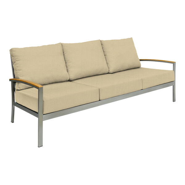 A Three Birds Casual Avanti Sand outdoor sofa with white cushions on a metal frame.