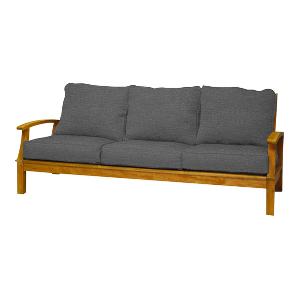 A Three Birds Casual Monterey wooden sofa with grey cushions.