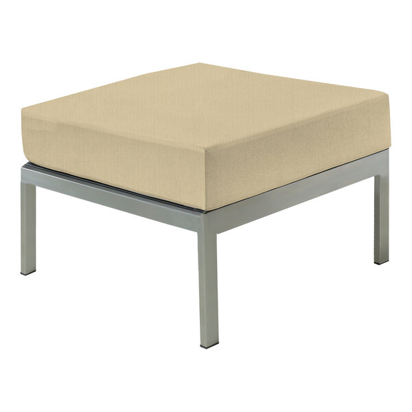 A white square Three Birds Casual Avanti sand ottoman with a white cushion.