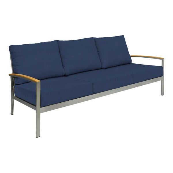 A navy Three Birds Casual Avanti outdoor sofa with blue cushions.