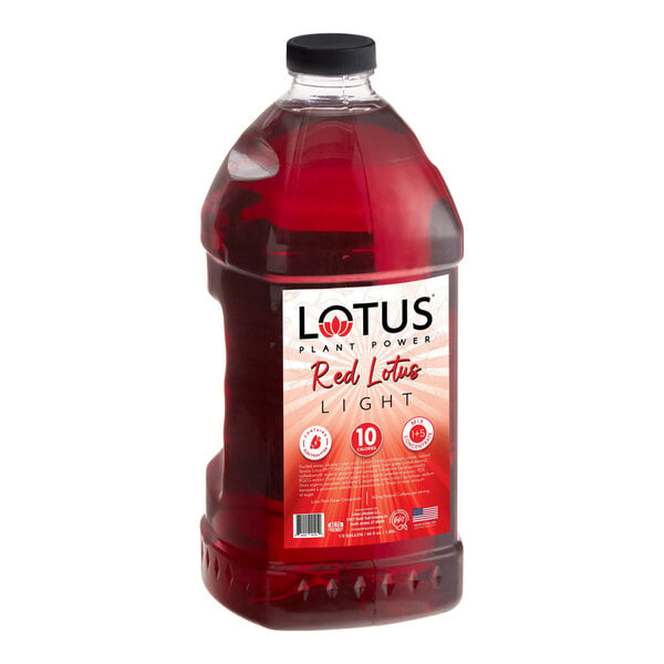 A large clear plastic bottle filled with red liquid and labeled 'Lotus Plant Power Red Lotus Light' with a black cap.