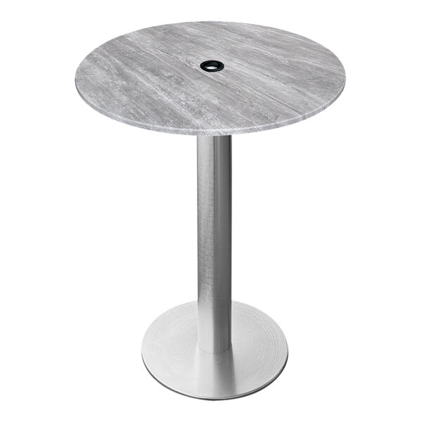 A round grey Holland Bar Stool table with a brushed aluminum base and umbrella hole.