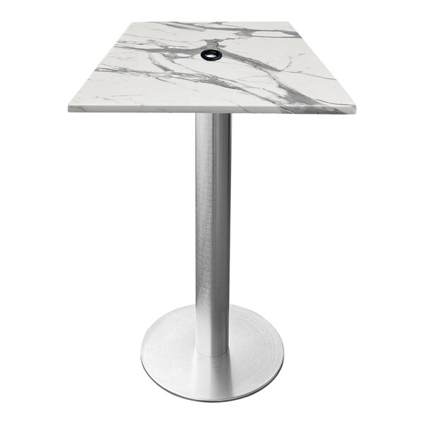 A white marble square table with a brushed aluminum base and an umbrella hole.