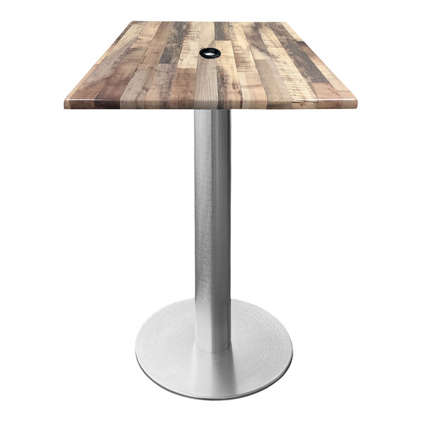 A wooden table with a metal base and umbrella hole.