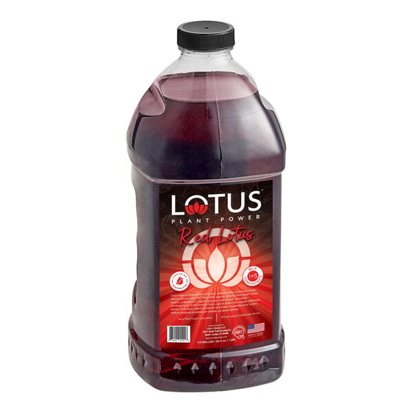 A large clear plastic bottle filled with a dark red liquid and labeled 'Lotus Plant Power Red Lotus 5:1 Energy Concentrate 64 fl. oz.'