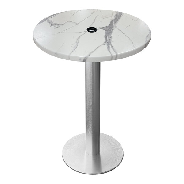 A round white marble table with a brushed aluminum base and an umbrella hole.