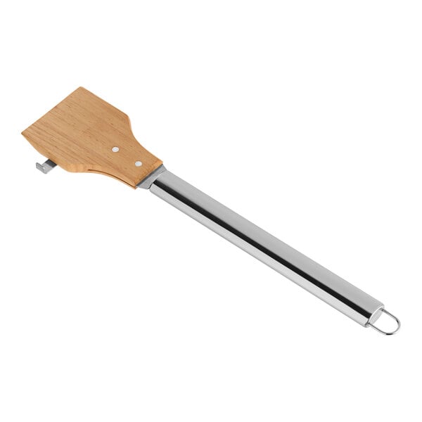 A close-up of a Mr. Bar-B-Q wood grill scraper with a metal handle.