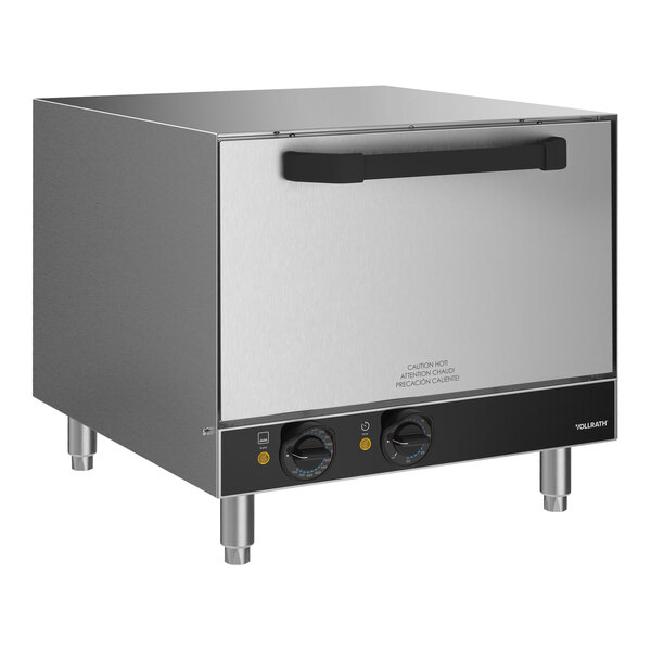 A stainless steel Vollrath countertop electric pizza oven with two doors.