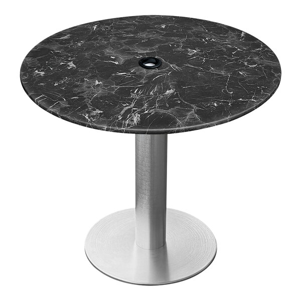 A round black marble table top with a metal base.