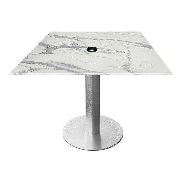 A white marble square table with a brushed aluminum base and umbrella hole.