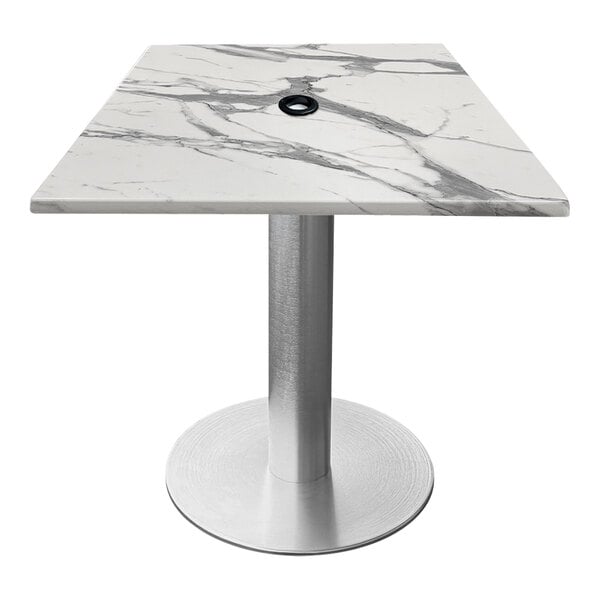 A white marble square table with a brushed aluminum base.